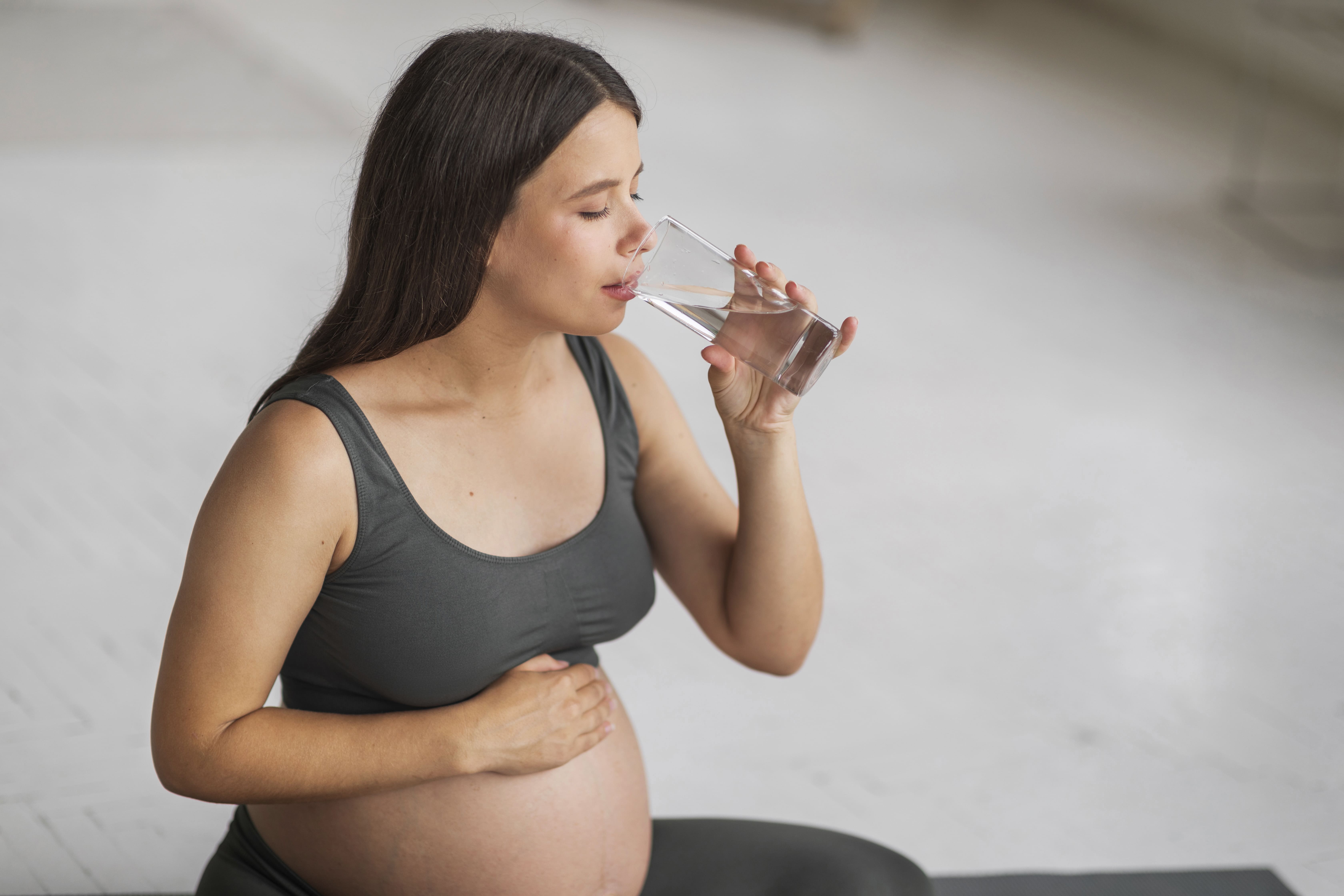 body-hydration-beautiful-young-pregnant-woman-drinking-water-from-glass-home.jpg