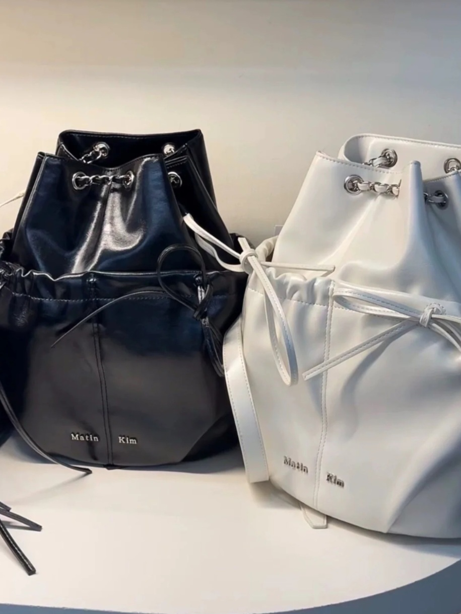 【Matin Kim】DRAW STRING RIBBON BACK PACK MUSINSA | MATIN KIM DRAW STRING RIBBON BACK PACK IN BLACK