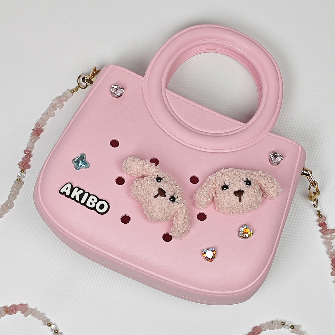 AKIBO滿月包-櫻花粉/粉嫩花瓣背帶(肩背手提洞洞包。中性款、輕量、防水)