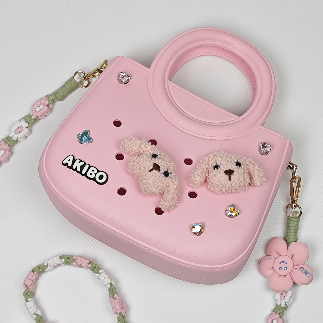 AKIBO滿月包-櫻花粉/手工編織花朵背帶(肩背手提洞洞包。中性款、輕量、防水)