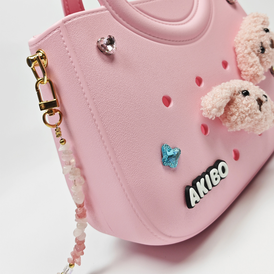 AKIBO滿月包-櫻花粉/粉嫩花瓣背帶(肩背手提洞洞包。中性款、輕量、防水)