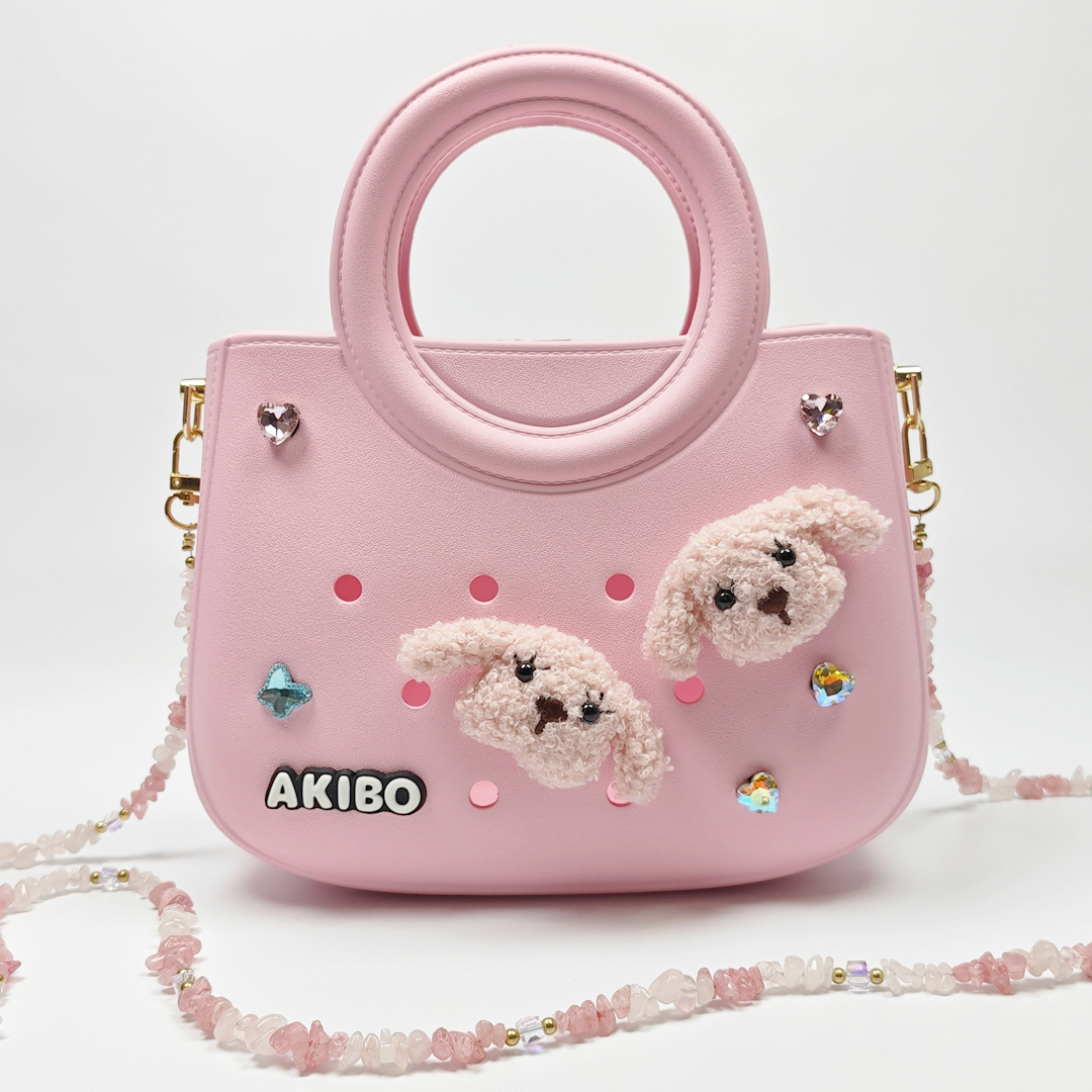 AKIBO滿月包-櫻花粉/粉嫩花瓣背帶(肩背手提洞洞包。中性款、輕量、防水)