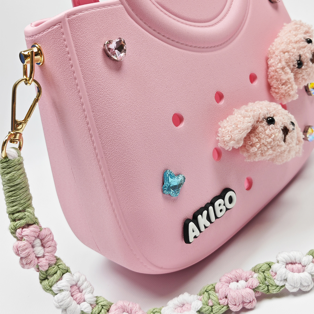 AKIBO滿月包-櫻花粉/手工編織花朵背帶(肩背手提洞洞包。中性款、輕量、防水)