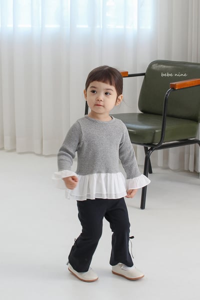 bebe nine07 (65-115) 3色荷葉裙擺上衣1