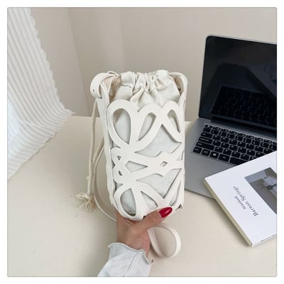 小眾設計感鏤空圓桶抽繩斜背包 輕巧百搭水桶包9
