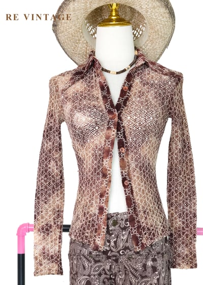 可可荒野夢幻簍空蕾絲上衣1