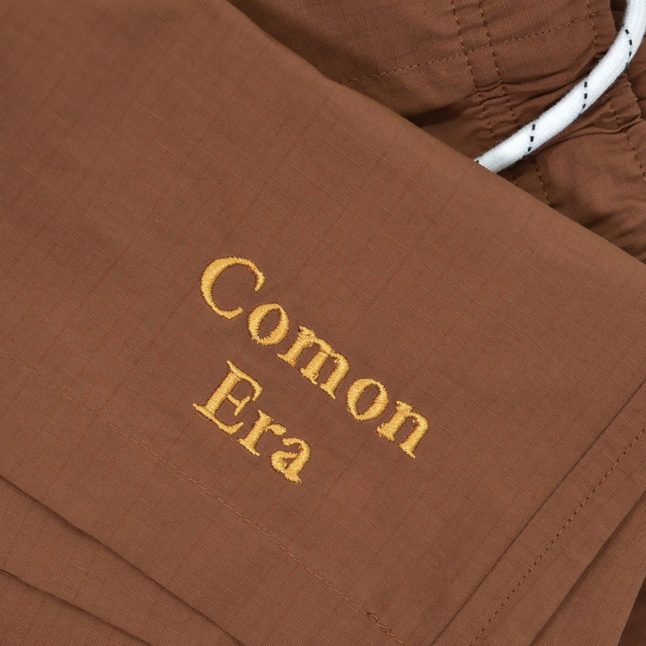 COMON ERA LOGO RIPSTOP BEACH SHORTS(深橙)