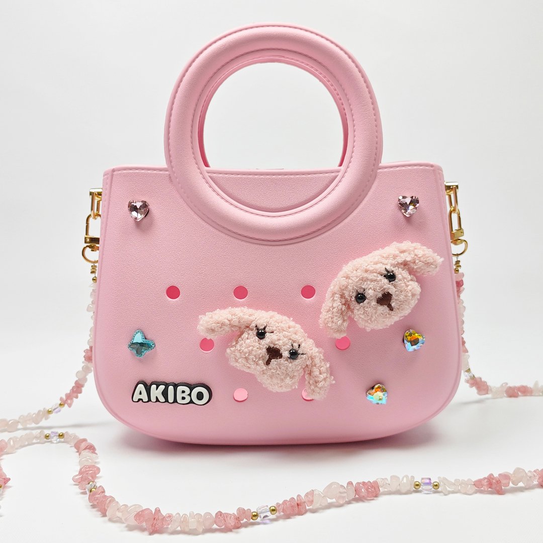 【買1送1】AKIBO滿月包-櫻花粉/粉嫩花瓣背帶(肩背手提洞洞包。中性款、輕量、防水) / 內附AKIBO品牌鞋扣1個。現在買再送鞋扣組(不挑款)