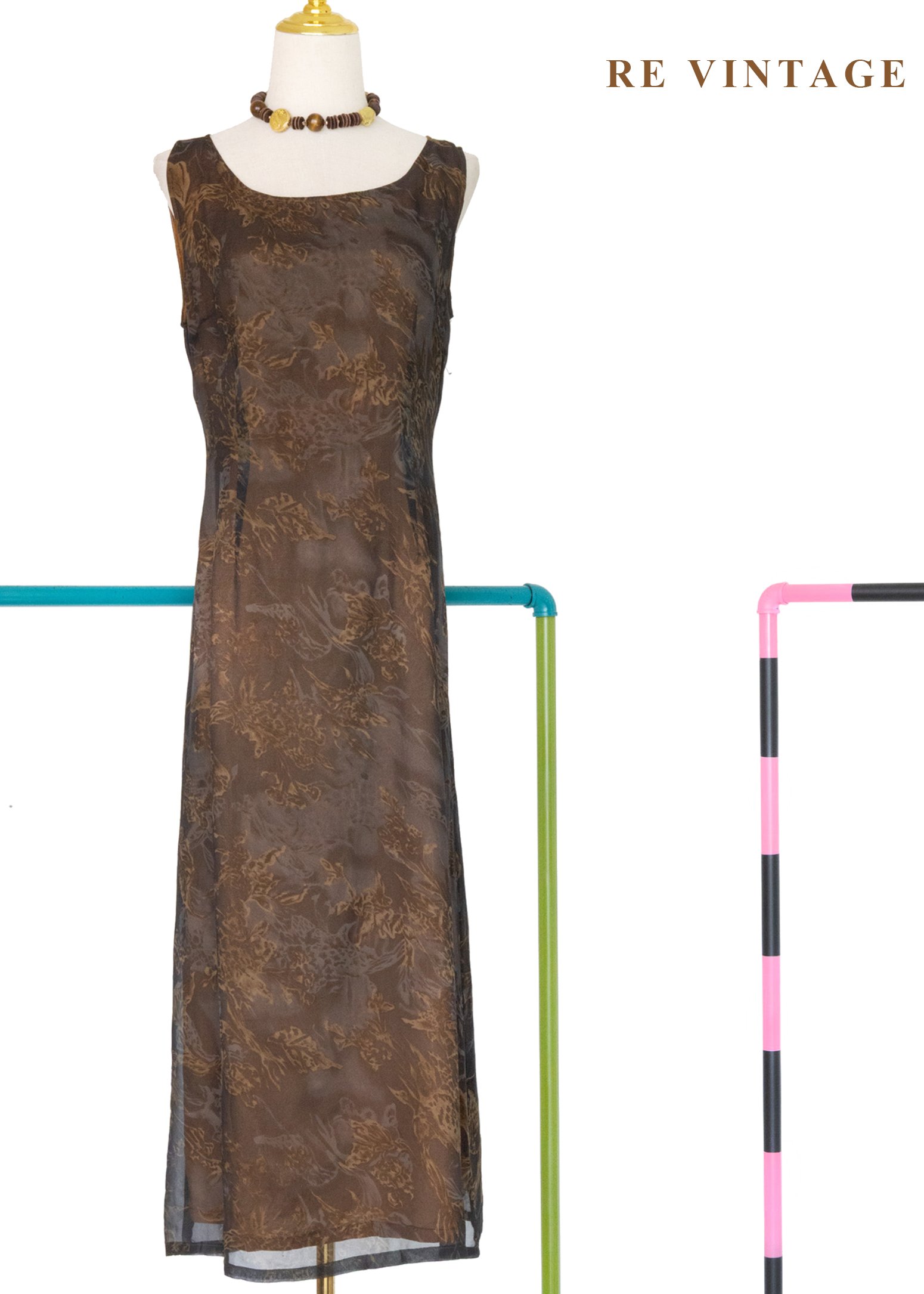 深灰紗中透著橘光抽象花朵長洋裝